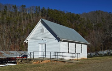 INMAN CHAPEL 
AND CEMETERY


- The 1902 chapel is the oldest Universalist Church in the state west of Durham. This modest white church was built by <i>Cold Mountain</i> Inman’s brother, James Anderson Inman. The congregation was responsible for initiating many of Haywood County’s first social programs. After an impressive restoration, the chapel recently received North Carolina Department of Transportation and Cultural Resources historic marker designation for the many unique programs conducted at the church by Minister Hannah Jewett Powell. In the accompanying cemetery dwell the remains of Inman family members, including the grandparents of Charles Frazier, author of <i>Cold Mountain</i>. All six books of <i>Legends, Tales & History of Cold Mountain</i> feature information about Inman Chapel and the Inman family.  See also <i>Walking in the Footsteps of Those Who Came Before Us</i> DVD.